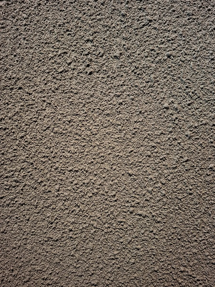 Tekstur permukaan Textura Sandspray dari dekat